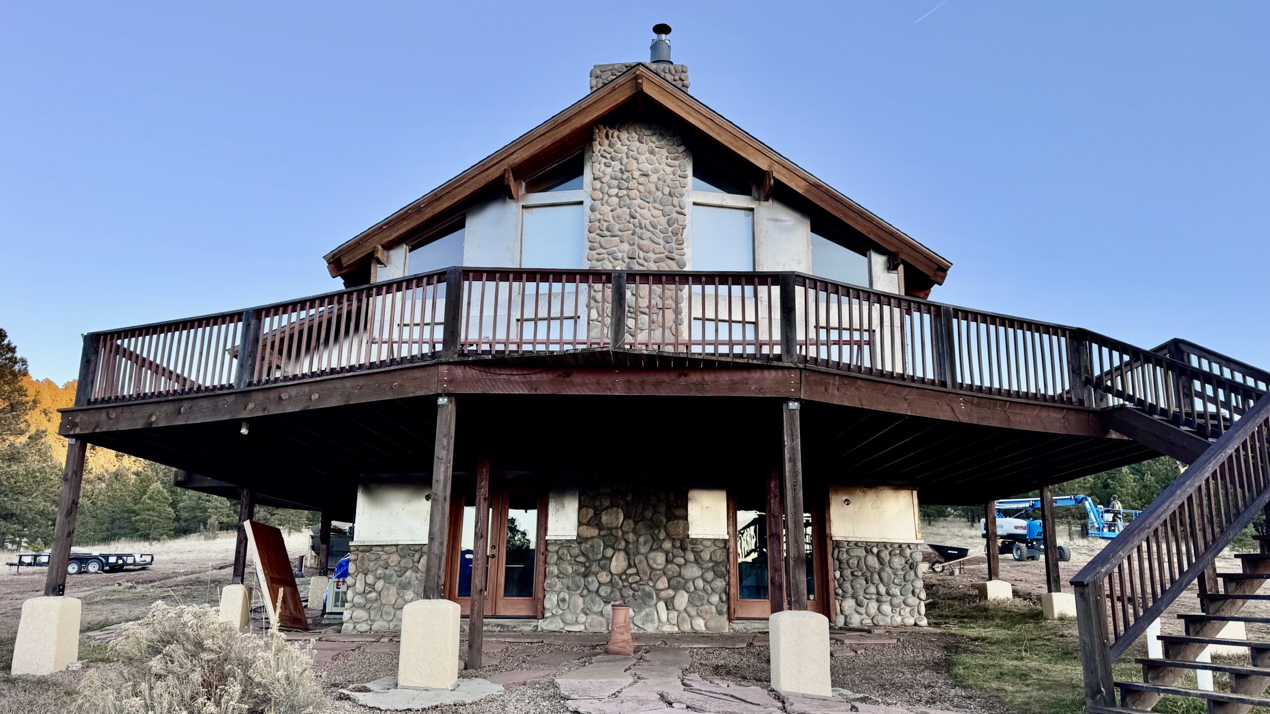 Luxury Florida pool home with white and metal siding