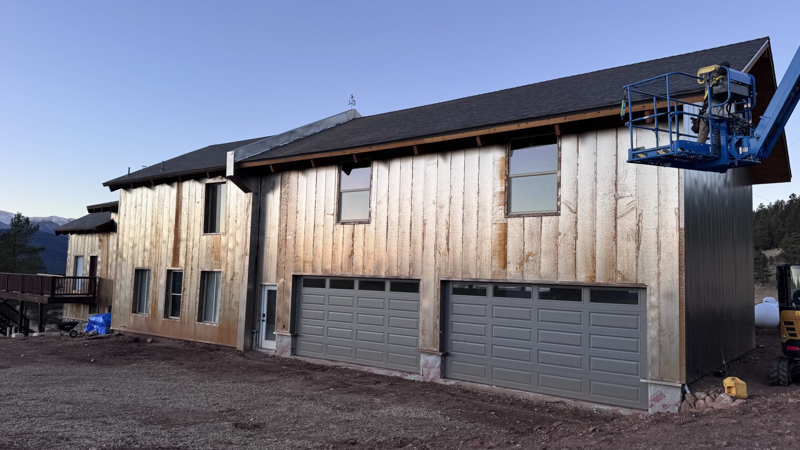 Modern Arizona home with dark vertical metal siding panels