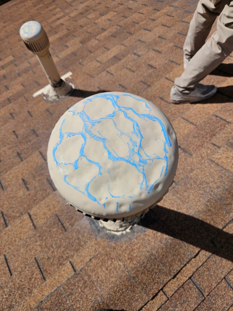 Roof vent cap with hail cracks circled in blue chalk during an FNF inspection in Raton, NM